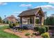 Community entrance sign with stone base, wood beams, and landscaping, welcoming residents and visitors at 111 Bell Chase Ln, Statesville, NC 28677