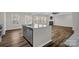 Island with stainless steel dishwasher overlooking living room with fireplace and natural light at 111 Bell Chase Ln, Statesville, NC 28677