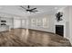 Open living area featuring wood floors, fireplace and seamless connection to the kitchen at 111 Bell Chase Ln, Statesville, NC 28677
