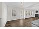 Open concept living room with fireplace, natural light and wood-style floors at 111 Bell Chase Ln, Statesville, NC 28677