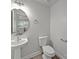 Stylish powder room with pedestal sink and round mirror at 118 Glade Valley Ave, Mooresville, NC 28117