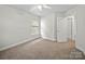 Bright carpeted bedroom with windows and ceiling fan at 118 Glade Valley Ave, Mooresville, NC 28117