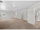 Large bonus room with neutral carpet, ceiling fan, and access to multiple rooms at 118 Glade Valley Ave, Mooresville, NC 28117