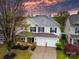 Charming two-story home with a manicured lawn, two-car garage, and inviting front porch at 118 Glade Valley Ave, Mooresville, NC 28117