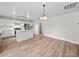 Bright kitchen featuring a kitchen island, stainless steel appliances, and modern lighting at 118 Glade Valley Ave, Mooresville, NC 28117