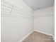 Walk-in closet includes shelving for storage, offering organization and convenience at 118 Glade Valley Ave, Mooresville, NC 28117