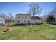 Large backyard with patio, fire pit, and privacy fence at 11929 Parks Farm Ln, Charlotte, NC 28277
