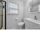 Clean and bright bathroom with a shower, sink, toilet, and window for ventilation at 11929 Parks Farm Ln, Charlotte, NC 28277