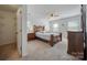 Comfortable bedroom with carpet, ceiling fan, and ample natural light from two windows at 11929 Parks Farm Ln, Charlotte, NC 28277