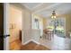 Bright breakfast nook with wood table, backyard views and easy access to bathroom at 11929 Parks Farm Ln, Charlotte, NC 28277