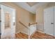 Second-floor hallway with hardwood floors and access to bedrooms and closets at 11929 Parks Farm Ln, Charlotte, NC 28277