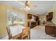 Bright eat-in kitchen featuring tile floors, wooden cabinets, granite countertops, and stainless steel appliances at 11929 Parks Farm Ln, Charlotte, NC 28277