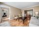 Open-concept living room with hardwood floors and a view of the dining area at 11929 Parks Farm Ln, Charlotte, NC 28277