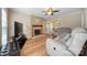 Comfortable living room featuring a fireplace with wood mantle and hardwood floors at 11929 Parks Farm Ln, Charlotte, NC 28277