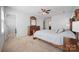 Bright primary bedroom with neutral walls, ensuite bathroom, and closet at 11929 Parks Farm Ln, Charlotte, NC 28277