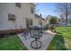 Outdoor patio with dining set and grill, perfect for entertaining and backyard barbeques at 11929 Parks Farm Ln, Charlotte, NC 28277