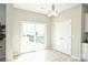 Bright dining area with sliding glass doors leading to the backyard and a closet at 1309 Afternoon Sun Rd, Matthews, NC 28104
