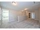 Spacious carpeted loft featuring neutral walls and ample natural light at 1309 Afternoon Sun Rd, Matthews, NC 28104