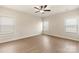 Spacious bedroom with ceiling fan and windows offering plenty of natural light at 136 Adams Tree Way, Troutman, NC 28166