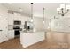 Well-equipped kitchen with stainless steel appliances and granite countertops provides modern convenience at 136 Adams Tree Way, Troutman, NC 28166
