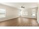 Bright and airy living room featuring hardwood floors, crown molding, and access to the outdoor space at 136 Adams Tree Way, Troutman, NC 28166