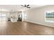 Spacious living area with hardwood floors, modern finishes, and an open view to the kitchen at 136 Adams Tree Way, Troutman, NC 28166