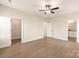 Large bedroom with a ceiling fan, walk-in closet, and ensuite bathroom for added comfort at 136 Adams Tree Way, Troutman, NC 28166