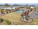 Beautiful aerial view of the community pool and playground with well-maintained landscaping and ample parking at 14703 Keyes Meadow Way, Huntersville, NC 28078