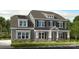 Charming two-story home showcasing a stylish facade, a covered entryway, and manicured landscaping at 14703 Keyes Meadow Way, Huntersville, NC 28078