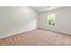 Bright bedroom featuring neutral carpet and a large window, creating a serene space at 1588 Doran Ter, Richburg, SC 29729