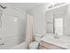 This bathroom features a shower-tub combo, and a light vanity with mirror at 16911 Commons Creek Dr, Charlotte, NC 28277