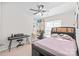 Cozy bedroom featuring a ceiling fan, natural light, and room for study or relaxation at 16911 Commons Creek Dr, Charlotte, NC 28277