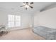 Spacious bedroom with a large window, ceiling fan, and carpet flooring at 16911 Commons Creek Dr, Charlotte, NC 28277