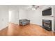 This is an unfurnished living room featuring hardwood floors and a fireplace perfect for cozy nights at 16911 Commons Creek Dr, Charlotte, NC 28277