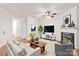 Bright living room boasts a cozy fireplace, modern furnishings, and stylish decor, creating a welcoming ambiance at 16911 Commons Creek Dr, Charlotte, NC 28277