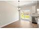 Bright dining area with sliding glass doors and contemporary light fixture at 173 Wembury Ln, Troutman, NC 28166