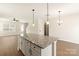 Bright kitchen with granite island, pendant lighting, and an open floor plan at 173 Wembury Ln, Troutman, NC 28166