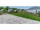 A backyard featuring a stone patio and a wrought iron fence at 1819 Lotus Ln, Denver, NC 28037