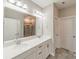 Bathroom featuring a double sink vanity with white countertops, and a glass enclosed shower at 1819 Lotus Ln, Denver, NC 28037