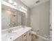 A bright bathroom with double sink vanity at 1819 Lotus Ln, Denver, NC 28037