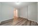 Well-lit bedroom featuring wood-look floors and ample space at 1819 Lotus Ln, Denver, NC 28037