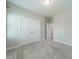 A carpeted bedroom with a closet at 1819 Lotus Ln, Denver, NC 28037