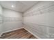 Walk-in closet with wood floor and wire shelving at 1819 Lotus Ln, Denver, NC 28037