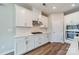 Gourmet kitchen featuring white cabinetry, stainless appliances, and sleek countertops at 1819 Lotus Ln, Denver, NC 28037
