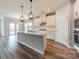 Stylish kitchen featuring a central island with modern light fixtures at 1819 Lotus Ln, Denver, NC 28037