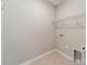 Efficient laundry room with shelving, ready for washer and dryer hookups at 1819 Lotus Ln, Denver, NC 28037