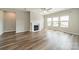 Spacious living room featuring fireplace and ample natural light at 1819 Lotus Ln, Denver, NC 28037