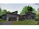 Stunning single-story modern home with sleek gray siding, a two-car garage, and a covered front entry at 1935 Weddington Rd # 1, Matthews, NC 28104