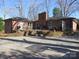 Backyard patio view of a brick home with an outdoor seating area at 215 Bailey Ave, Rock Hill, SC 29732