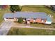 Aerial shot showcasing a brick home with a well-manicured yard, inviting curb appeal at 2704 Silvers Ln, Albemarle, NC 28001